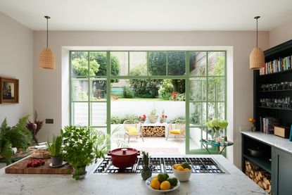 should the hob go in the kitchen island? Basement kitchen with hob on kitchen island by deVOL