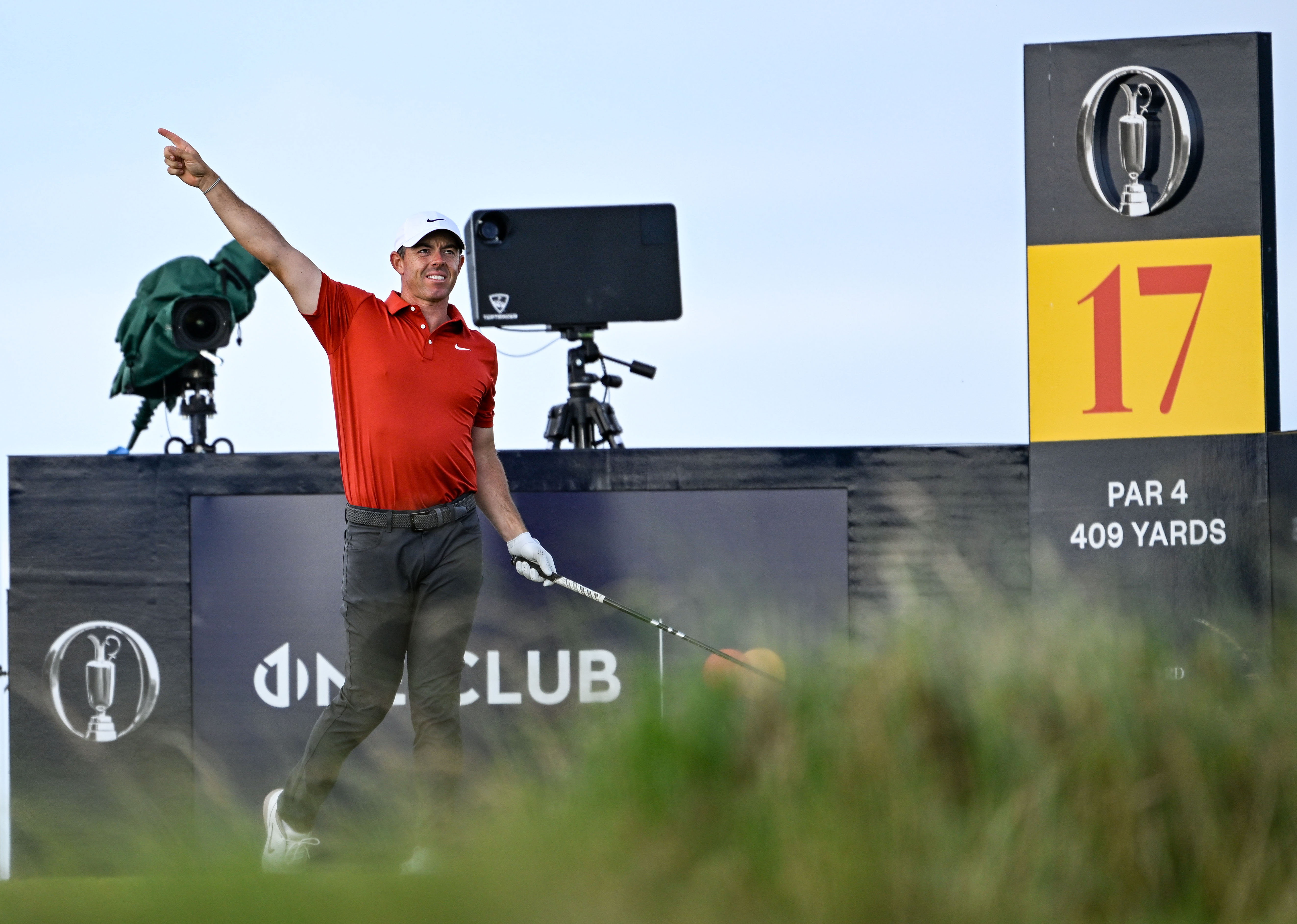Rory McIlroy points right after hitting a wayward drive on the 17th at Royal Portrush
