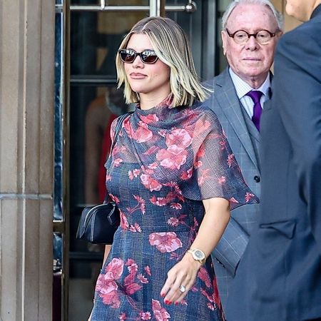 Sofia Richie Grainge wore a floral dress with slim wedges and an Ala&iuml;a bag