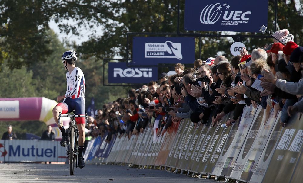Thomas Pidcock (Great Britain) checks behind as he nears the finish of the European championships