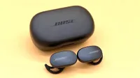 The Bose QuietComfort Earbuds on a yellow backdrop