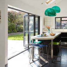 kitchen with dining table and chair and bi folding doors