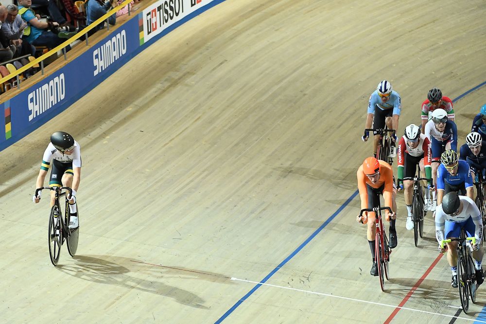 Australian Cameron Meyer (L) looks back at Netherland's Jan Willem Van Schip during the men's points race final during the UCI Track Cycling World Championships