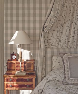 Bedroom, bed, wallpaper, quilt and canopy with matching floral and grey gingham fabric and wallpaper, antique sidetable