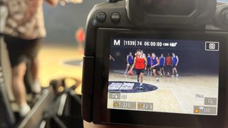 Back of a Canon camera, demonstrating the Registered People Priority mode using registered faces of a basketball team