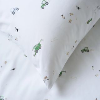 A close up of a kids duvet set with a ditsy print