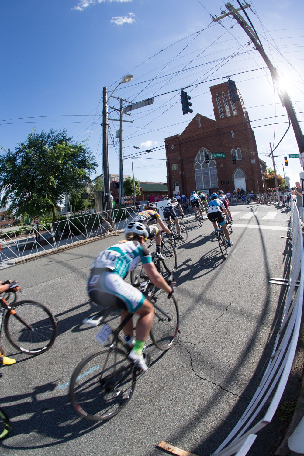 Riders head into the last corner before the descent to the finish.