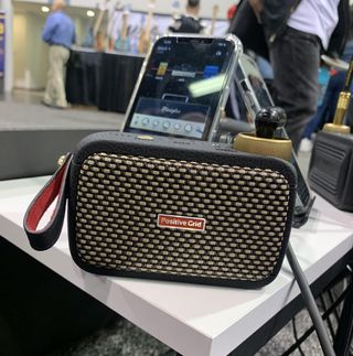 Positive Grid's Spark Go amplifier sits on a table at the 2023 NAMM show