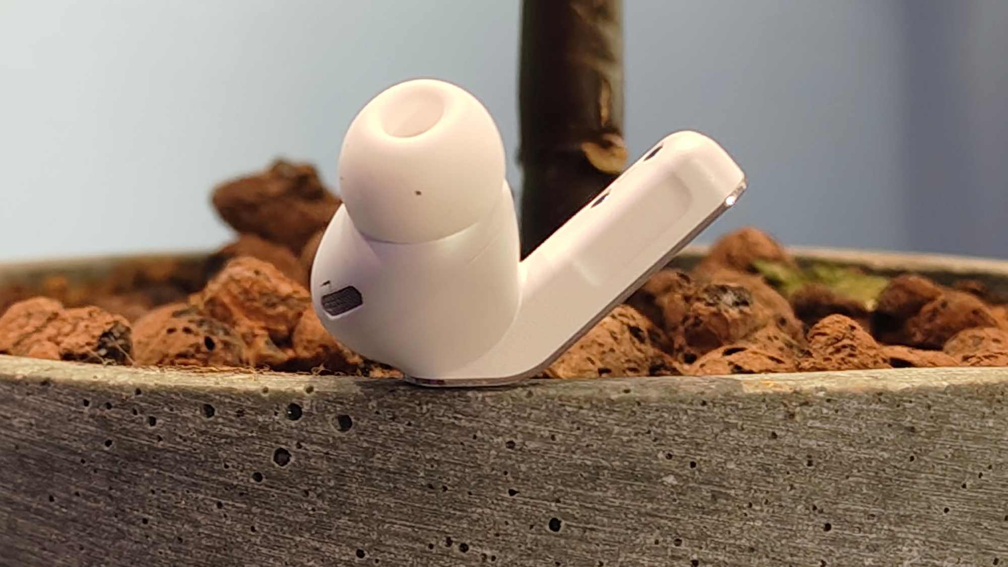 The Samsung Galaxy Buds 4 Pro, on a plant pot.