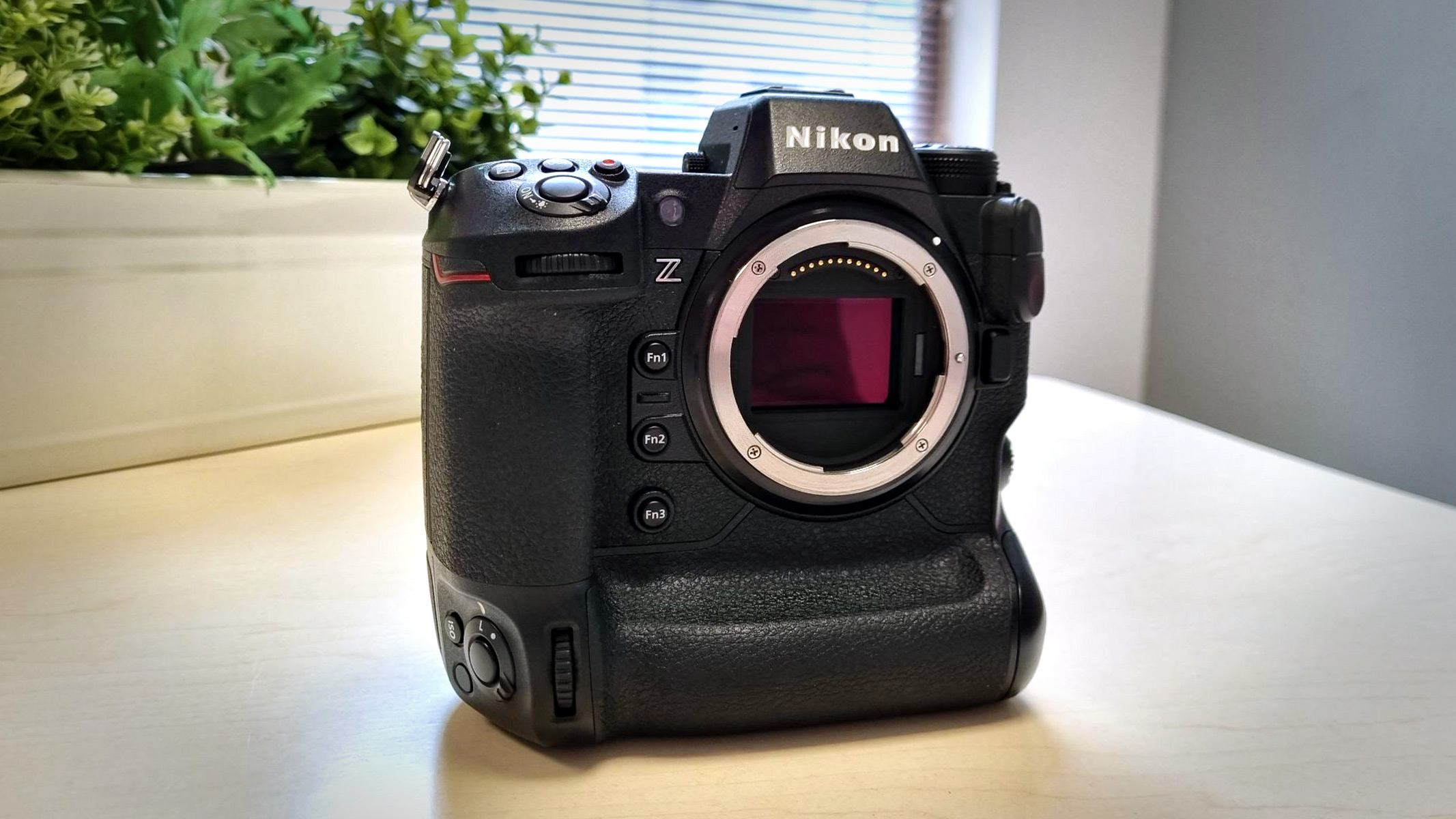 Nikon Z9 on a wooden table in front of a window