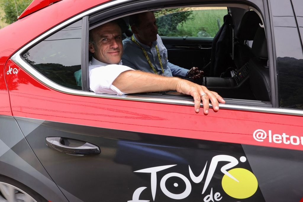 French President Emmanuel Macron rides in the organisation vehicle with Tour the France director Christian Prudhomme on the Col du Tourmalet during the 6th stage of the 110th edition of the Tour de France cycling race 145 km between Tarbes and CauteretsCambasque in the Pyrenees mountains in southwestern France on July 6 2023 Photo by Thomas SAMSON AFP Photo by THOMAS SAMSONAFP via Getty Images