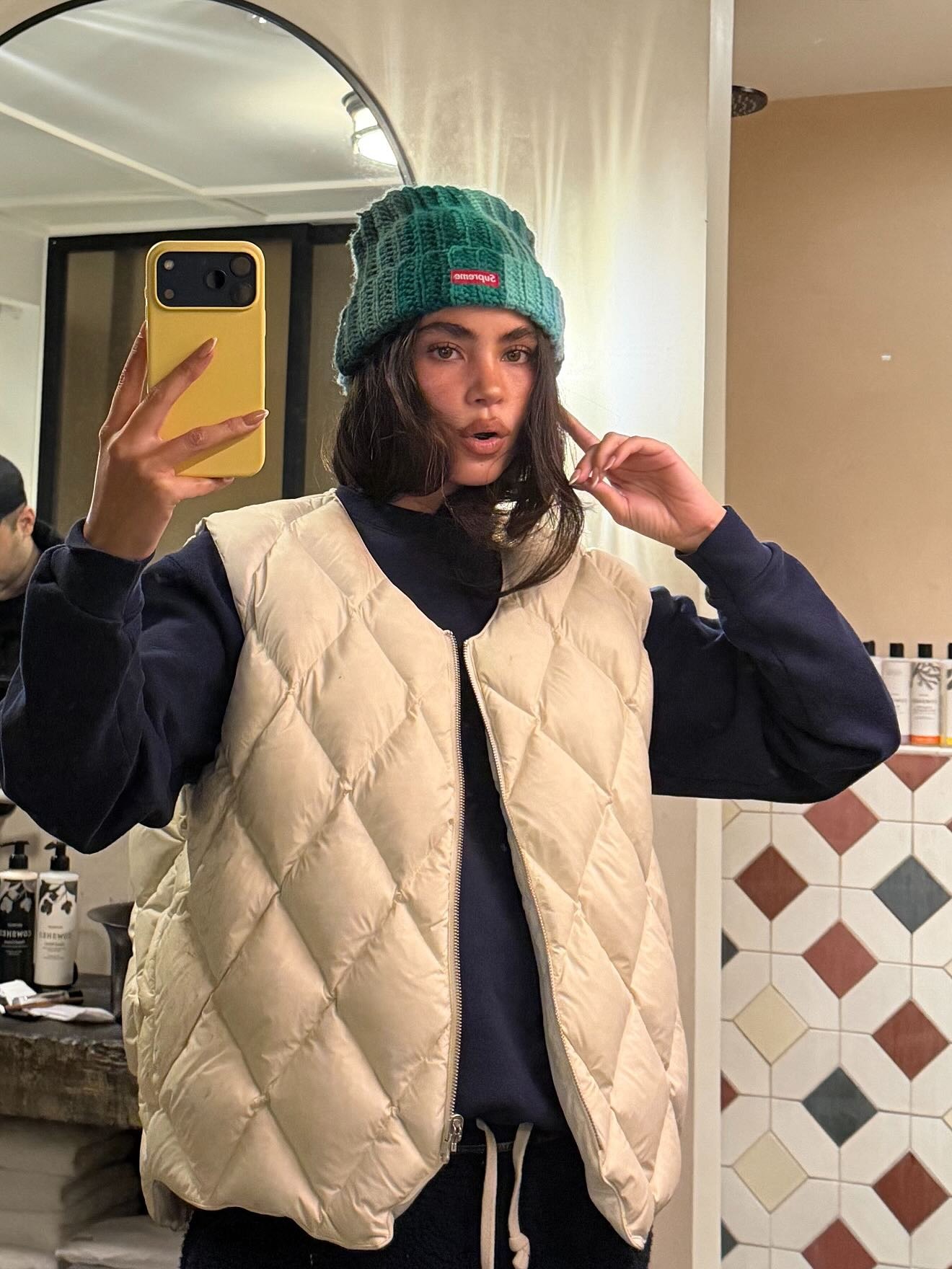 Fashion person @christinanadin wears a London Spring Capsule wardrobe 2026 piece. She wears a gilet.