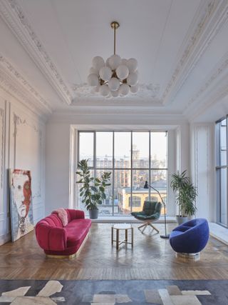 A bright living room with colorful upholstery