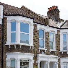 roofline of terraced houses with large windows