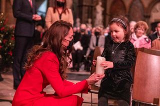 Kate Middleton with little girl and candle