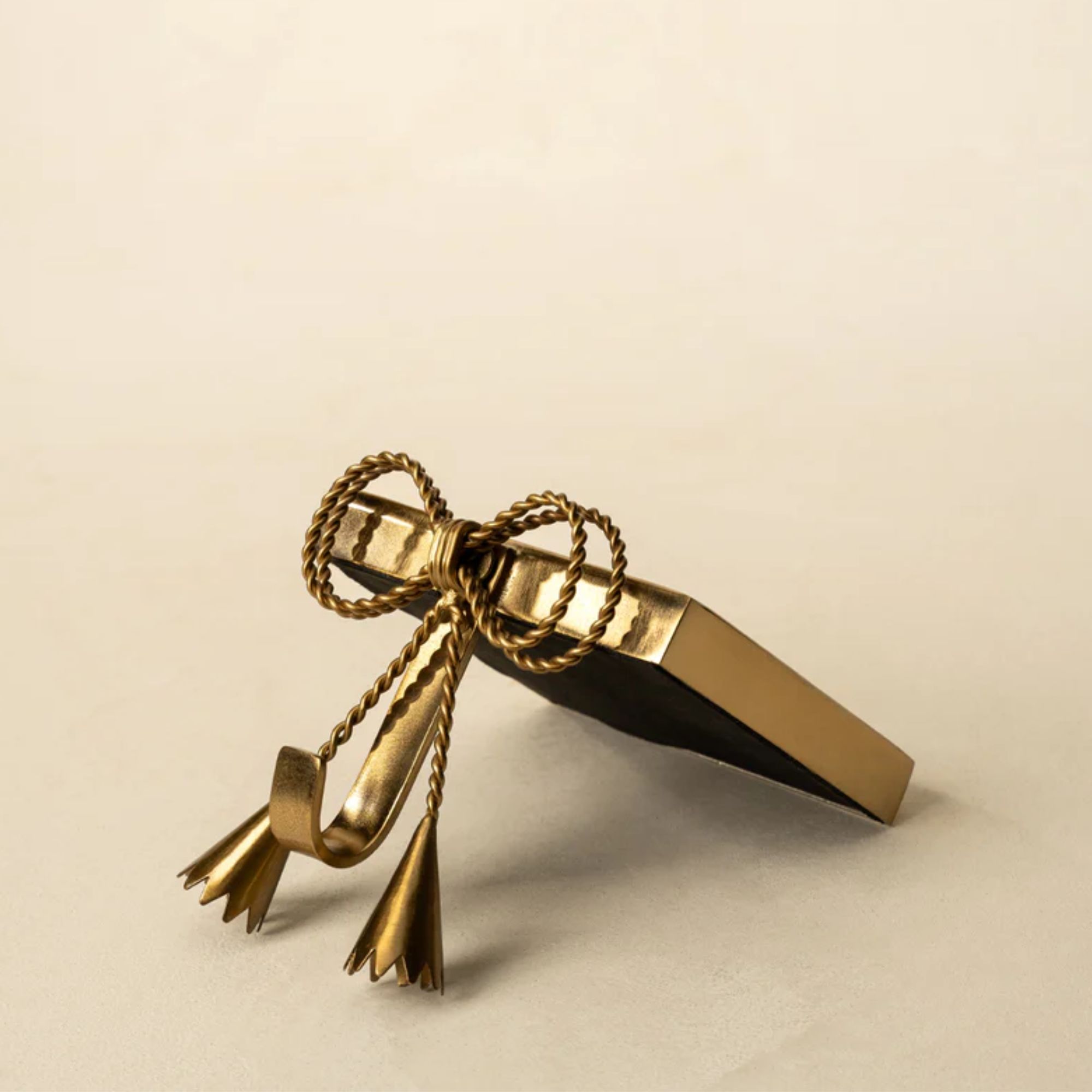 Gold bow stocking holder