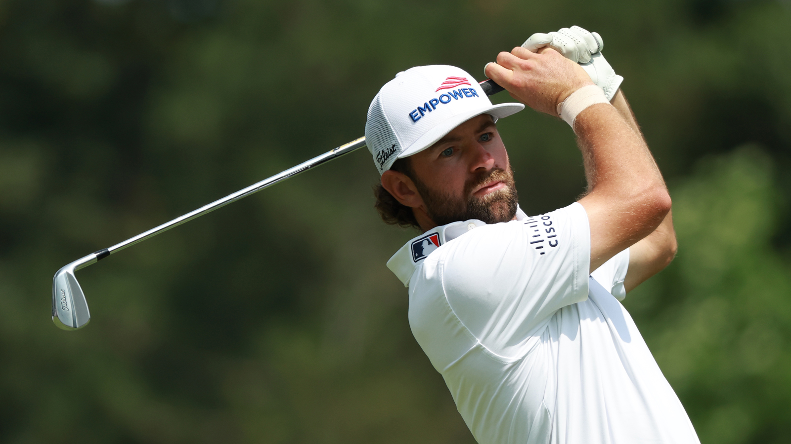 Cameron Young hits an iron shot