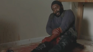 Tyreese holding his bite in The Walking Dead.
