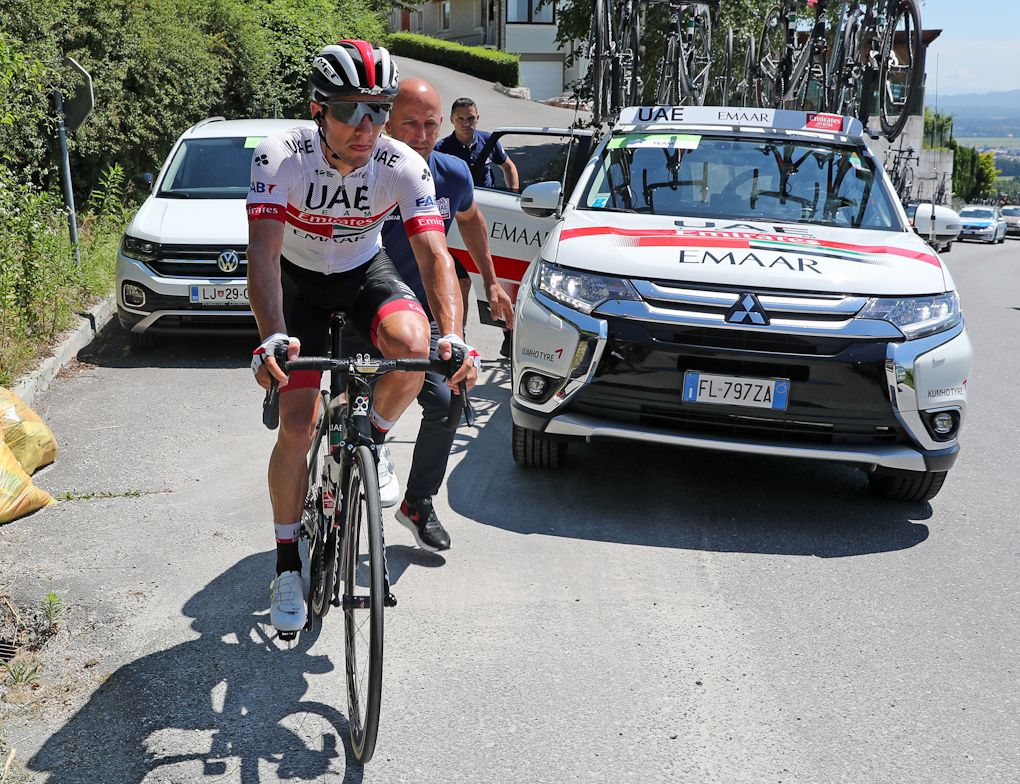 Jan Polanc (UAE Team Emirates) gets going after a mechanical