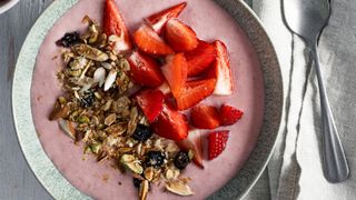 Smoothie bowl with granola and strawberries