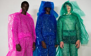 Three male models wearing colourful clothing by Craig Green.