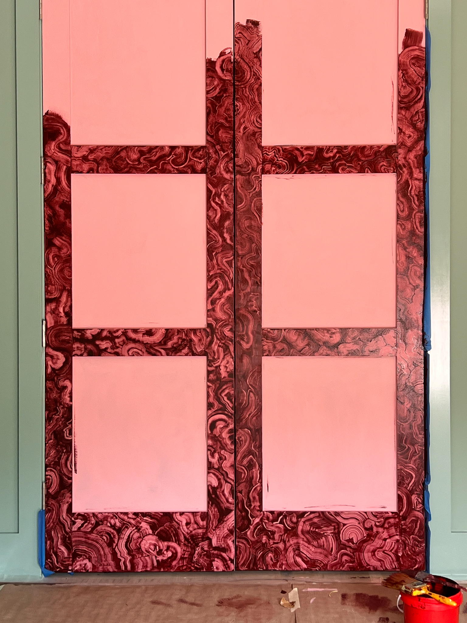 A close up of imitation red &#039;jewel&#039; doors in progress