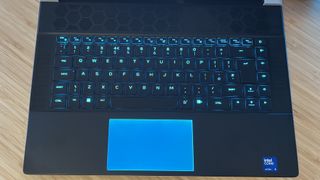 Top down view of Alienware X16 R2 gaming laptop keyboard and RGB trackpad