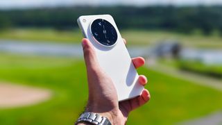 Prakhar Khanna holding the Oppo Find X8 Ultra.