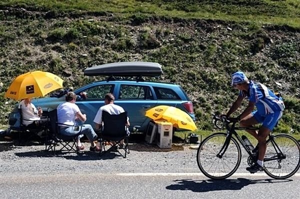 Fans make every effort to enjoy the race in the Alps.