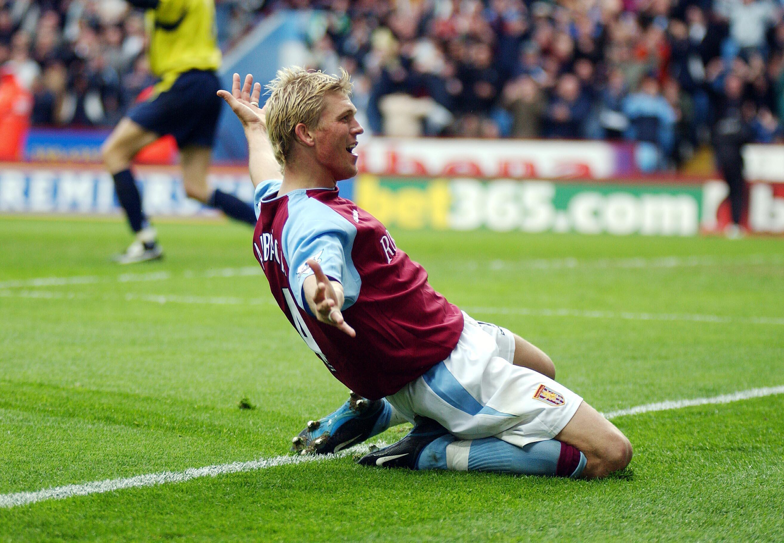 Marcus Allback celebrates his winner for Aston Villa