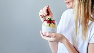 woman eating a chia pudding