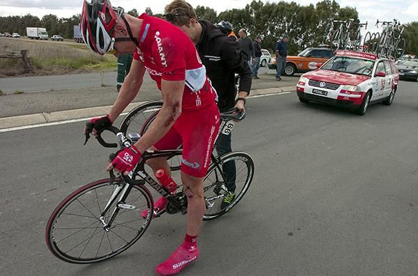 David Kelly (Drapac Porsche) is assisted after crashing early into stage four, Kelly later abandoned the tour.