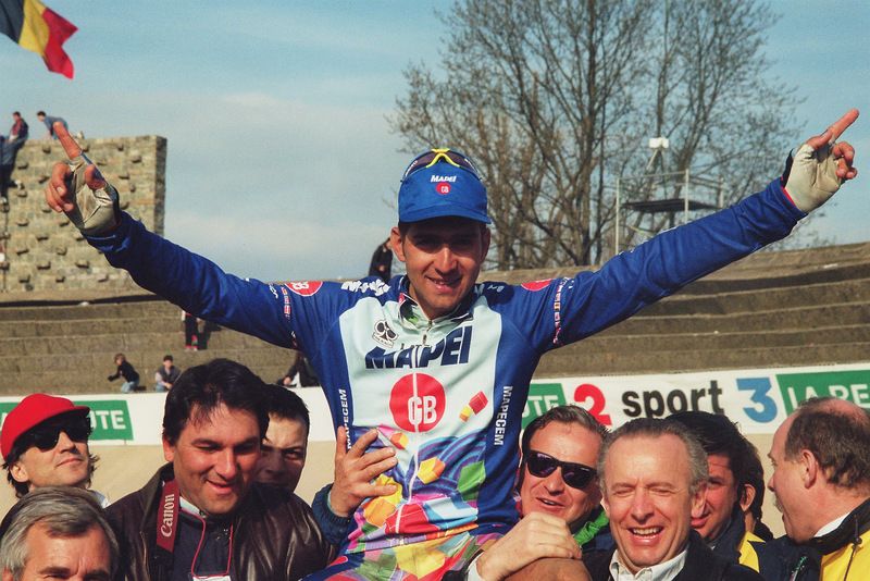 Franco Ballerini is hoisted into the air by fans after his 1995 victory