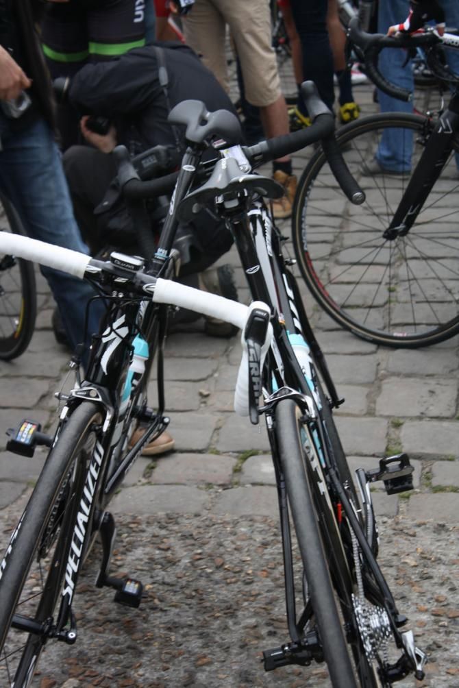 Iljo Keisse and Zdenek Stybar's bikes balance precariously against each other