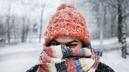 woman in hat and snowy weather