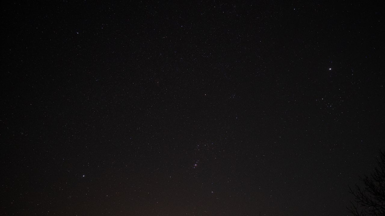The night sky showing Sirius, Orion and Jupiter.