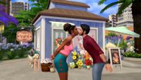 The SIms 4 Lovestruck expansion - two sims lean over to kiss lightly outside a neighborhood cafe