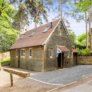 church house with stone walls and rough road