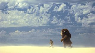 A boy walks with a wild thing in the desert in Where the Wild Things Are