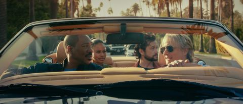 Eddie Murphy as Axel Foley, Taylour Paige as Jane Saunders, Joseph Gordon-Levitt as Detective Bobby Abbott, and Bronson Pinchot as Serge driving a car in Beverly Hills Cop: Axel F. 