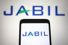 Jabil company logo on a smartphone and blurred in the background