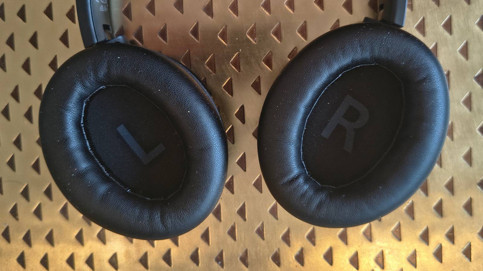 The Earfun Tune Pro atop a bronze table.