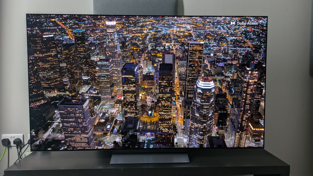 LG C5 with aerial shot of city at night on screen