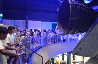 Crowds come face to face with the space shuttle Atlantis June 29, 2013, on opening day of its exhibition at the Kennedy Space Center Visitor Complex in Cape Canaveral, Florida.