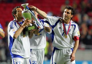 Theo Zagorakis kisses the European Championship trophy after Greece's win over Portugal in 2004.