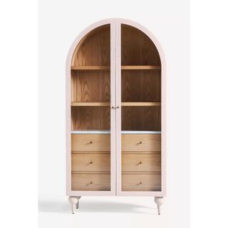 pale wood arched top storage cabinet with glass front