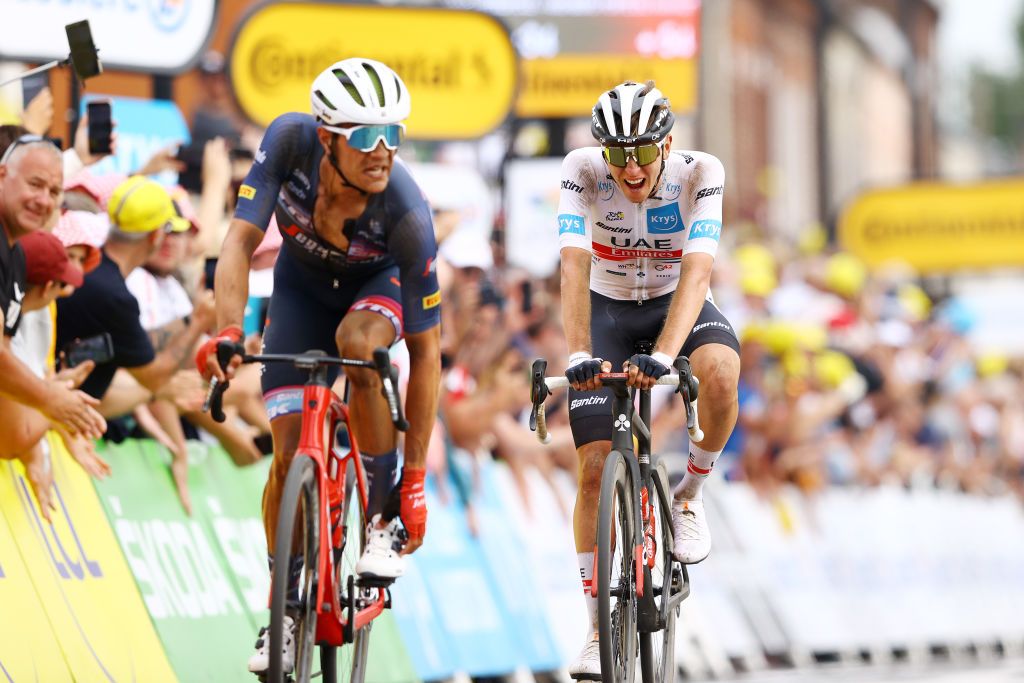 WALLERS FRANCE JULY 06 LR Jasper Stuyven of Belgium and Team Trek Segafredo and Tadej Pogacar of Slovenia and UAE Team Emirates White Best Young Rider Jersey cross the finish line during to the 109th Tour de France 2022 Stage 5 a 157km stage from Lille to WallersArenberg TDF2022 WorldTour on July 06 2022 in Wallers France Photo by Michael SteeleGetty Images