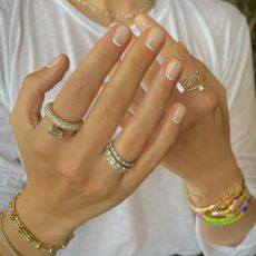 A white reverse French tip manicure