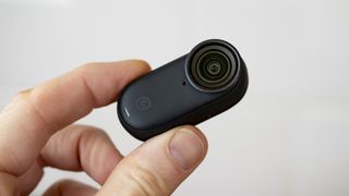 Tiny Insta360 Go 3S camera only in the hand