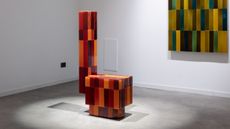 tiled objects in a white gallery setting